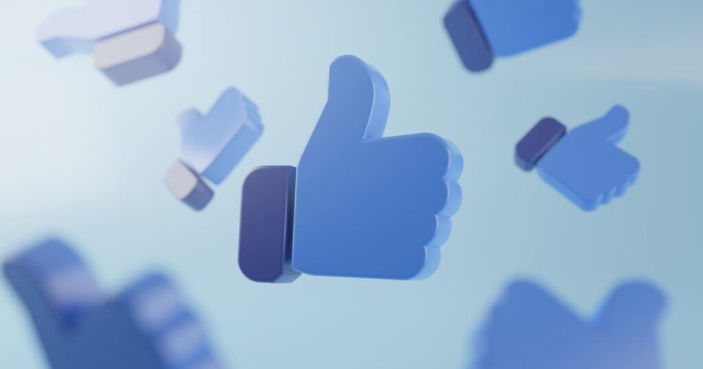 Íconos 3D de “me gusta” flotando, representando interacciones digitales sin conversión.